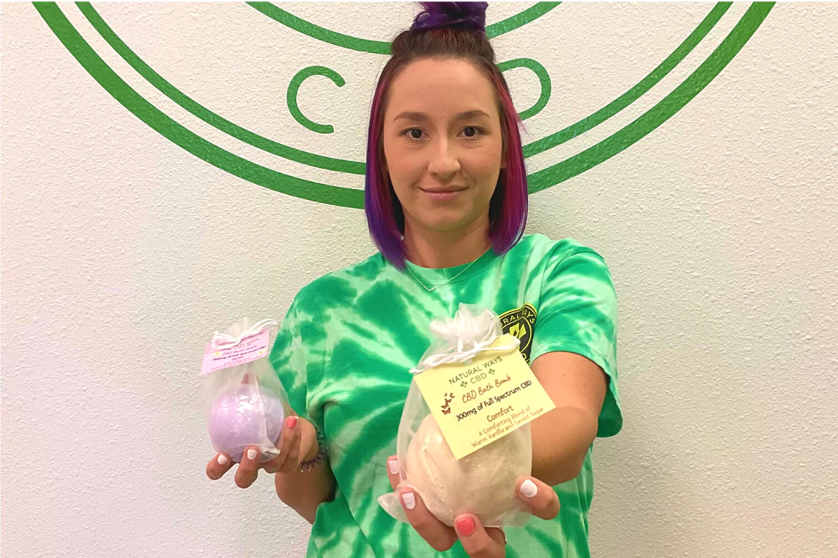 Woman holding natural ways CBD bath bombs