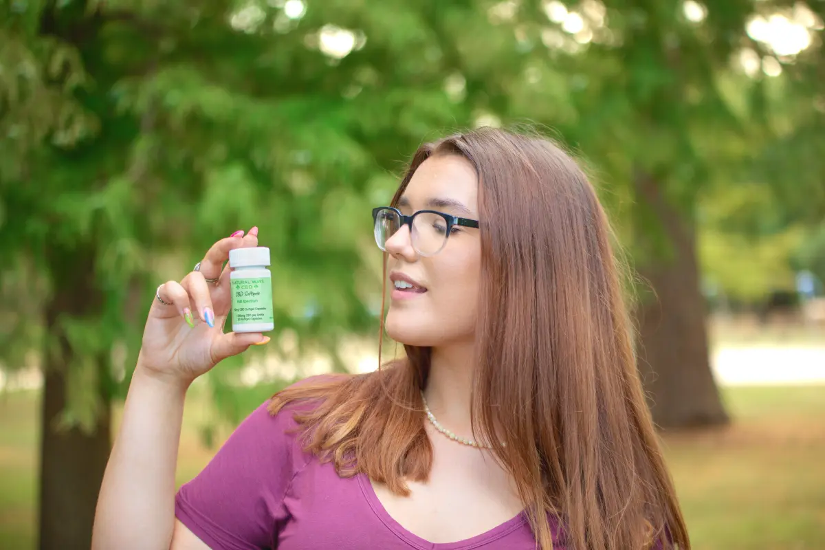 Woman enjoying natural ways CBD softgels