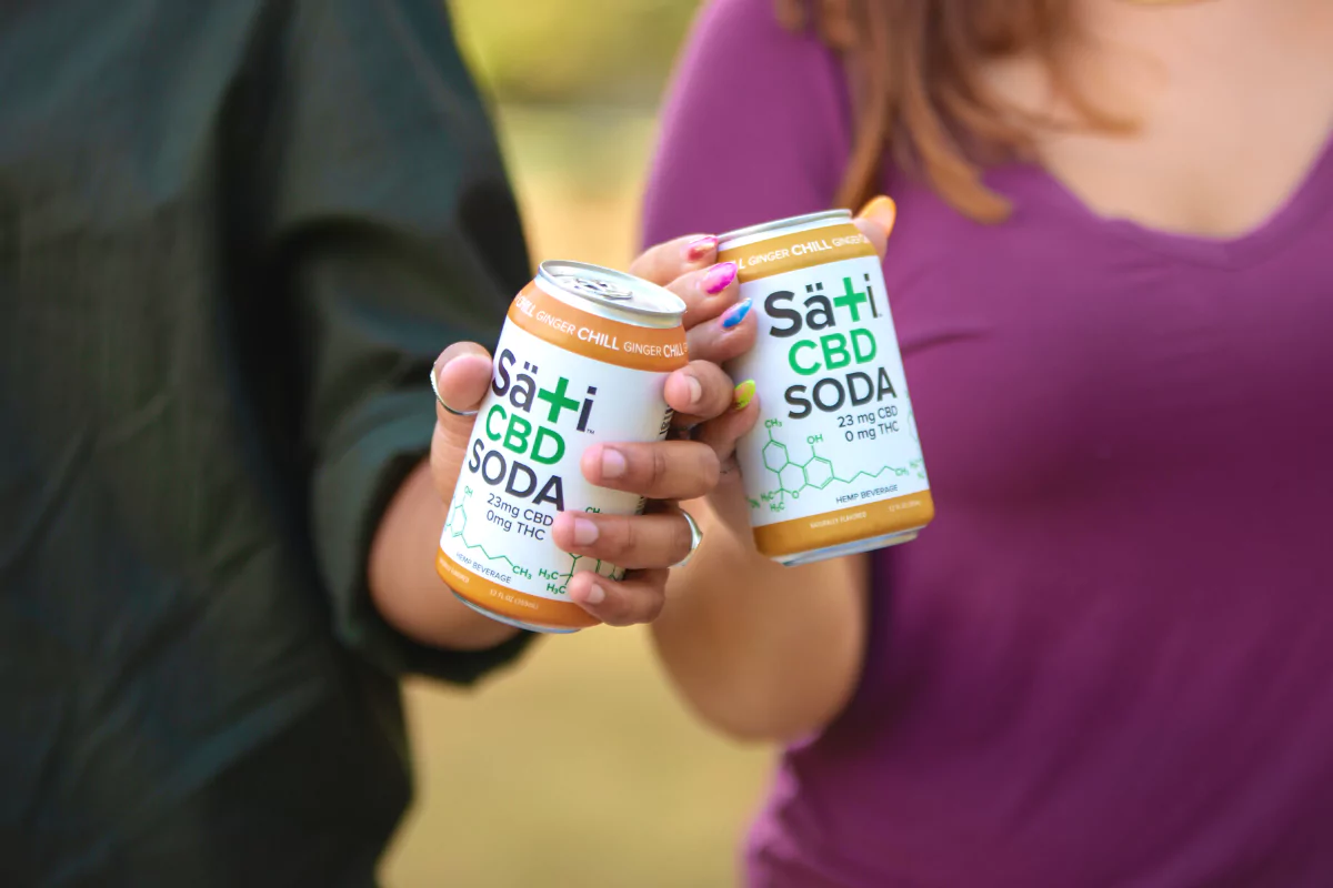 Two people enjoying Sati CBD Sodas CBD and THC