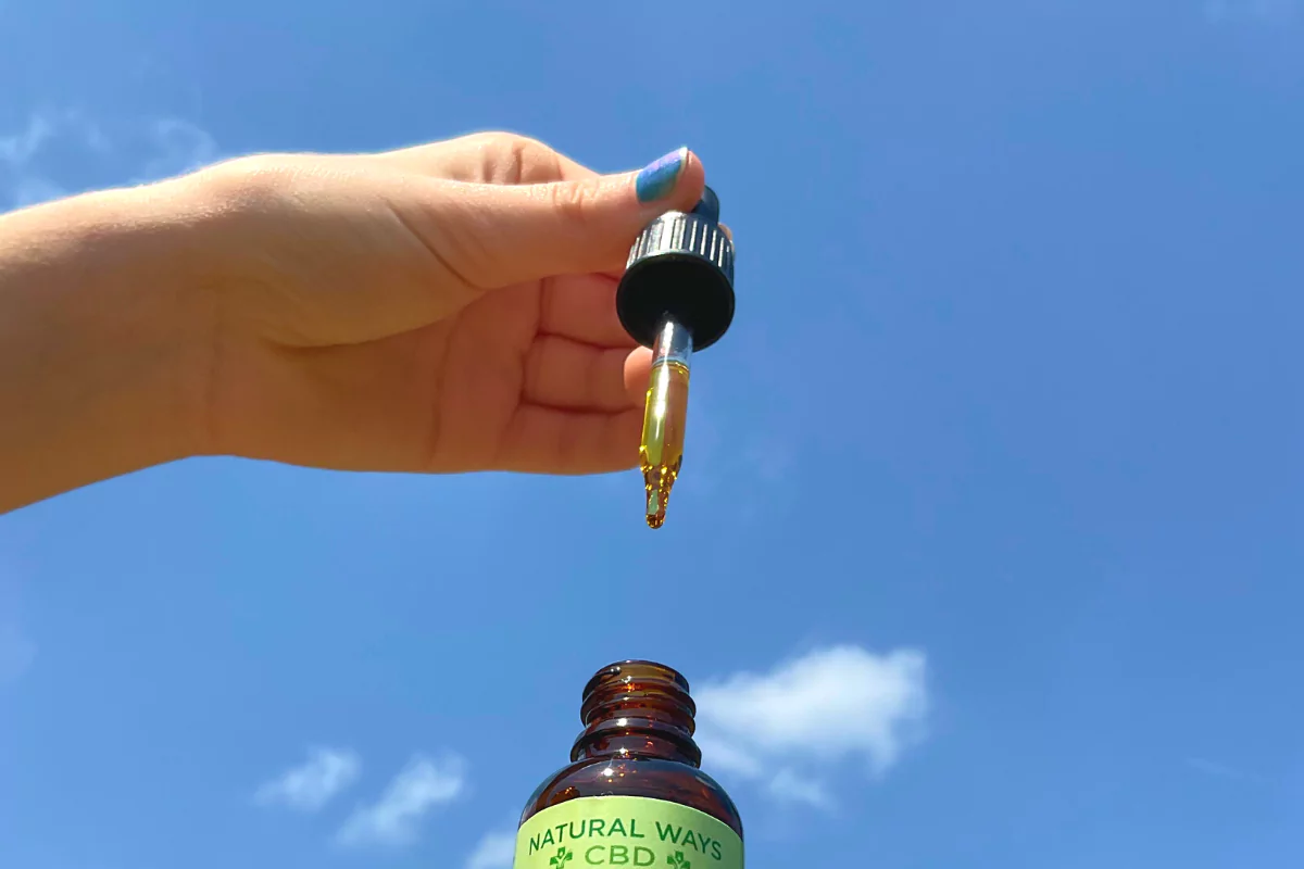 Natural Ways CBD tincture against blue sky background